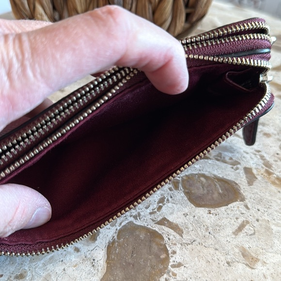 Coach double zipper wallet in burgundy pebbled leather. Measures 6 1/2” x 4”. - Picture 4 of 5